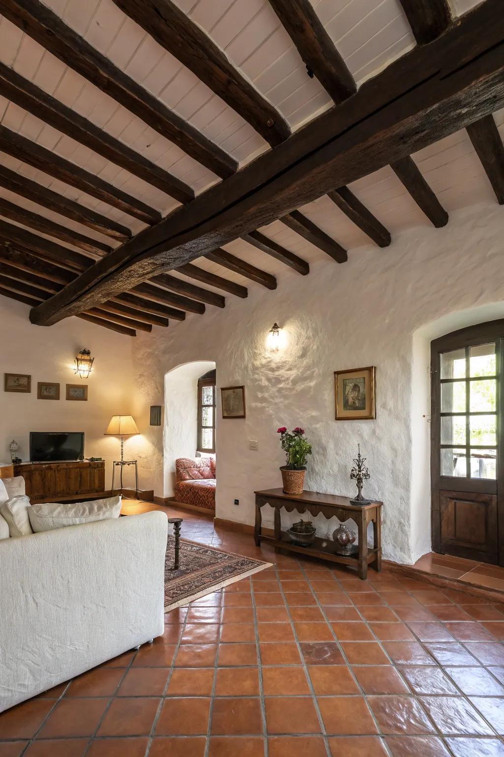 Exposed wooden beams add a rustic charm to this Spanish style living room.