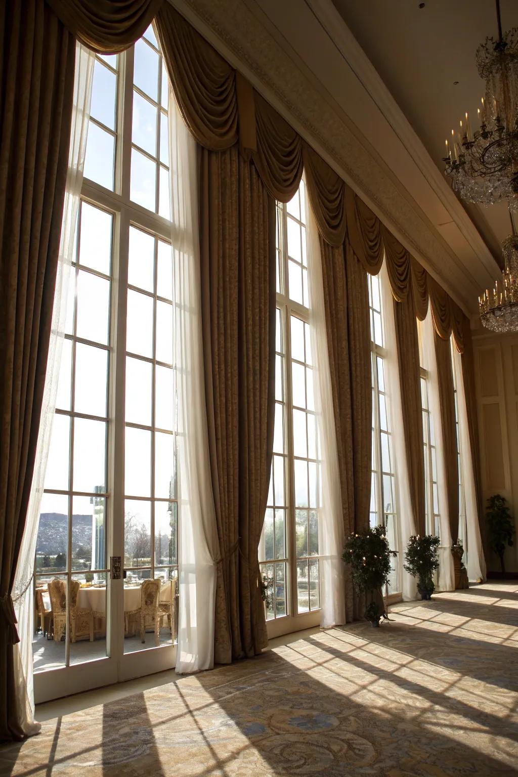Elegant drapery that accentuates the grandeur of towering windows.