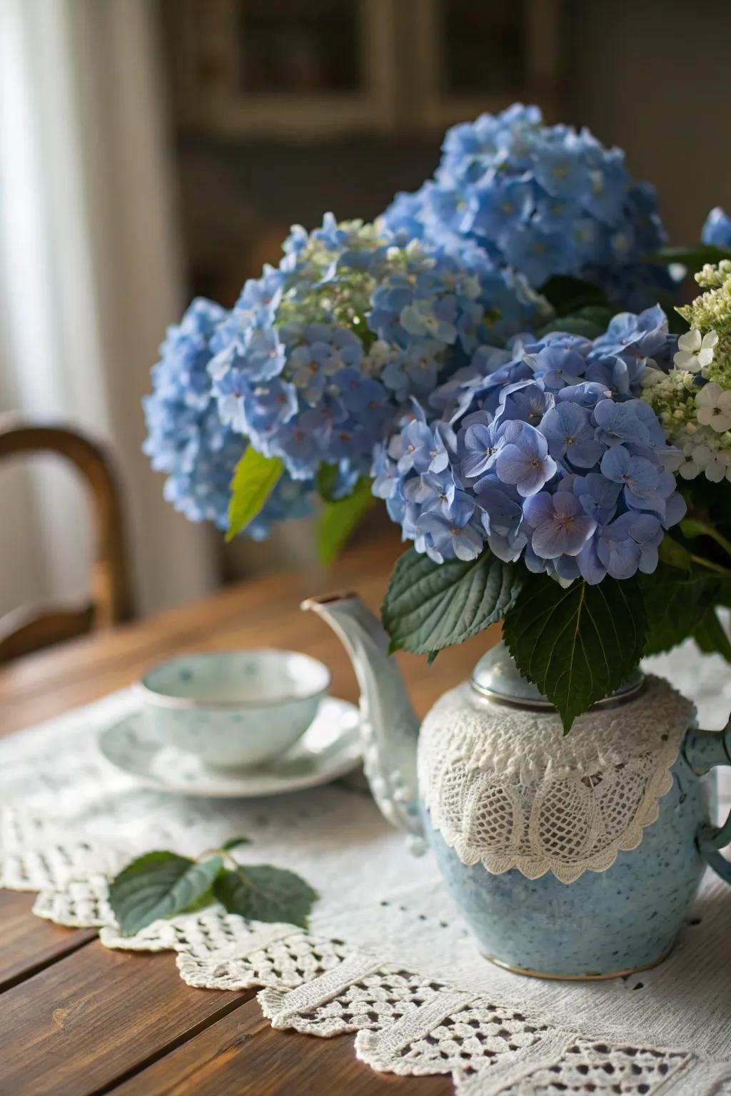 An antique teapot stands out as a charming vessel appropriate for azure hydrangeas.