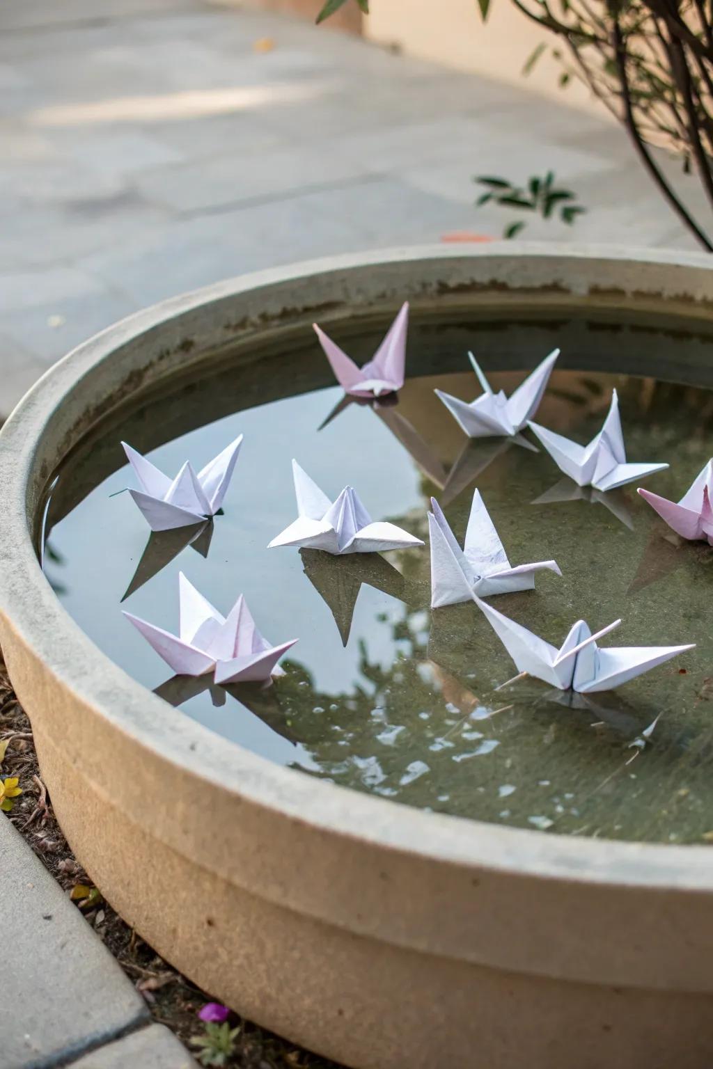 A serene reflective basin with floating avian figures.