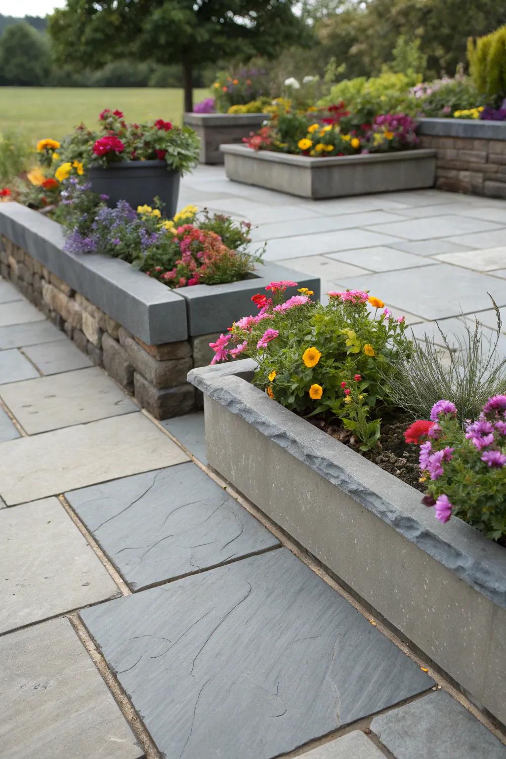 A slate patio complemented by integral containers for additional greenery.