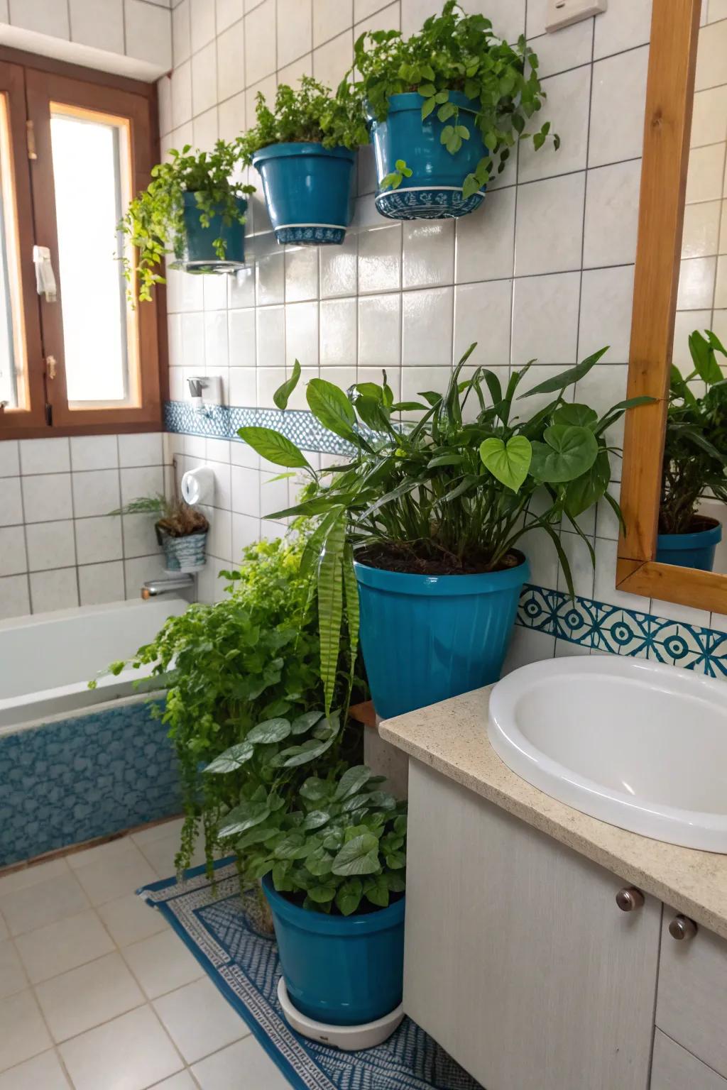 Blue planters and accessories bring a refreshing and vibrant energy to the bathroom.