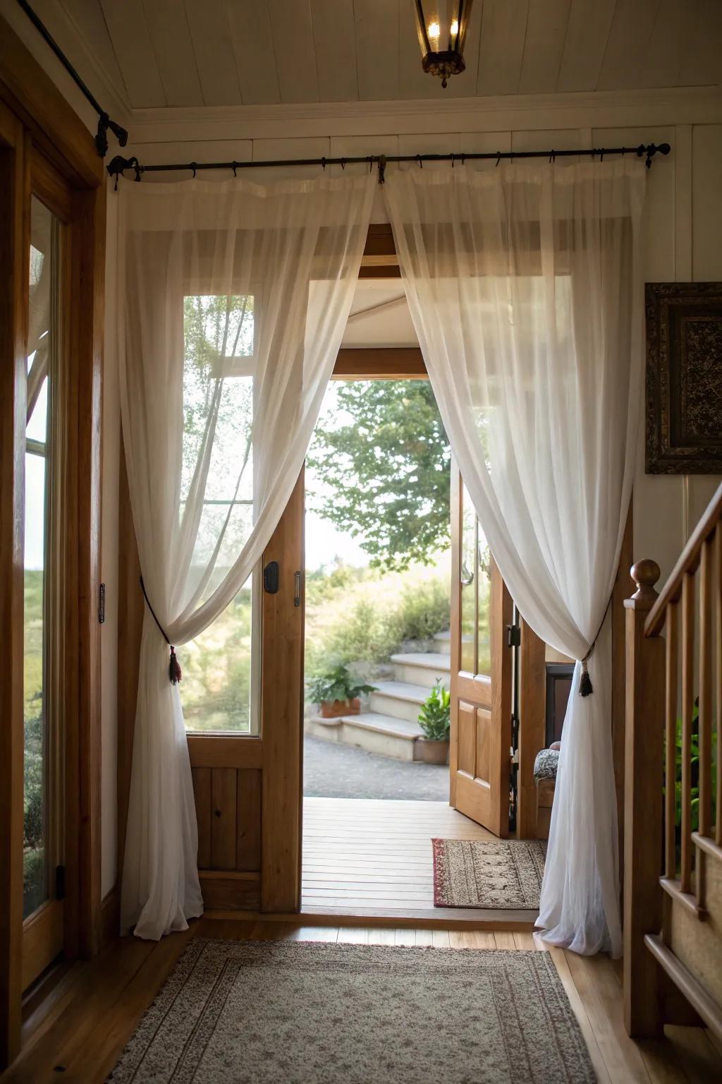 Sheer curtains maximize natural light, making the entryway feel bright and open.