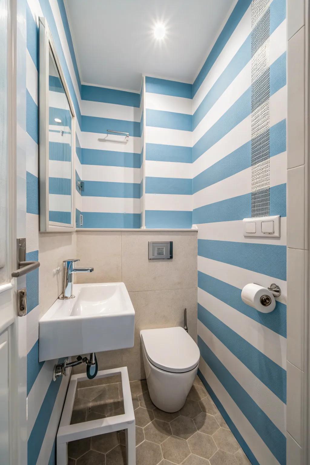 Blue and white stripes introduce a nautical theme while enhancing the space's height.