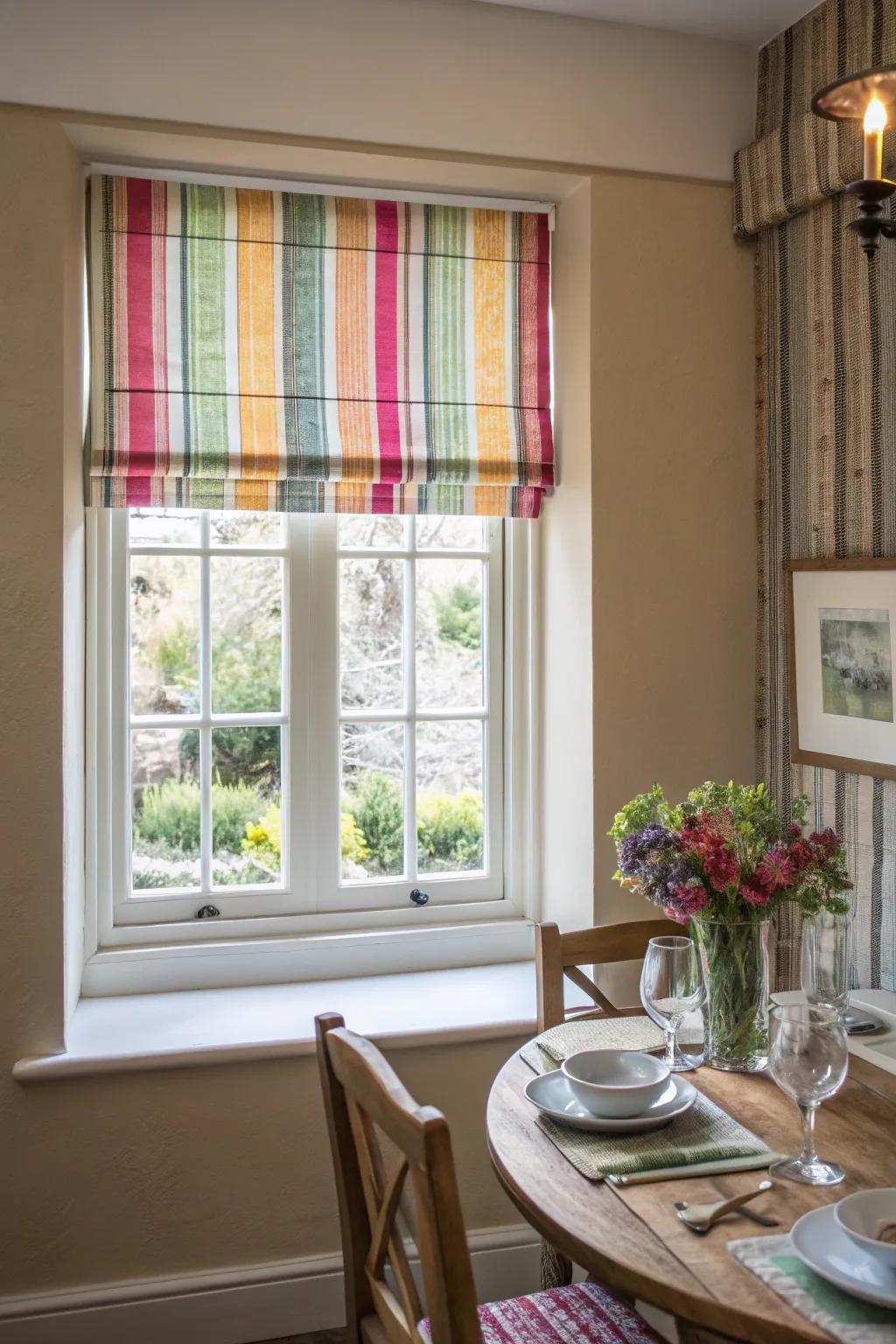 Roman shades in a vibrant color bring life to a small dining room.