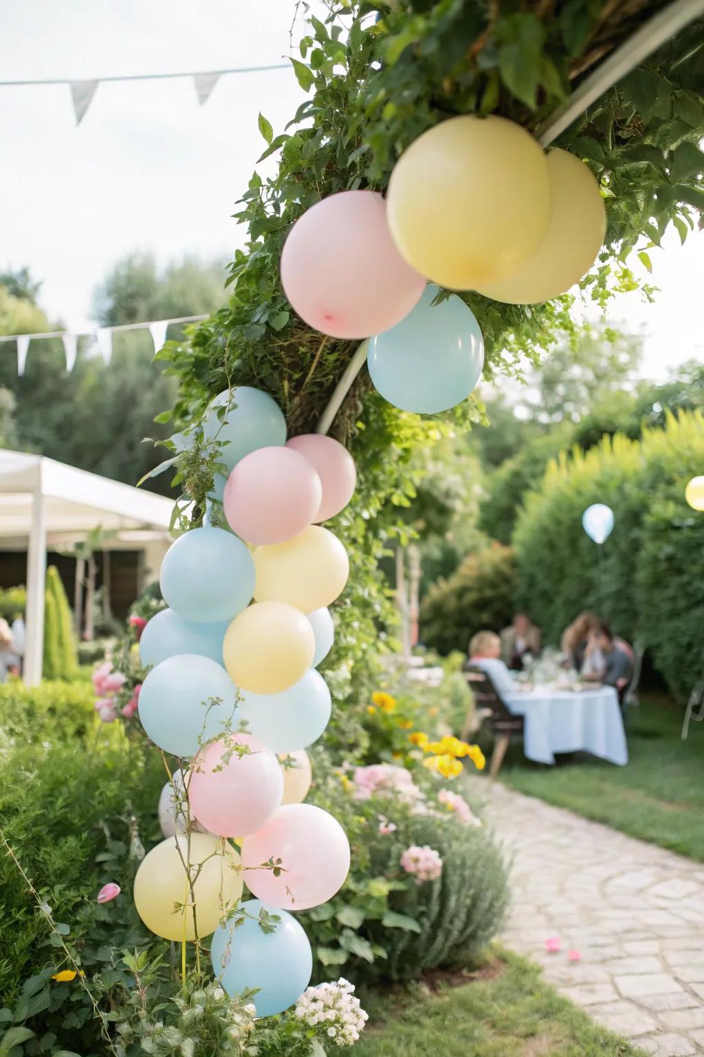 Dreamy pastel balloon garland perfect for garden celebrations.