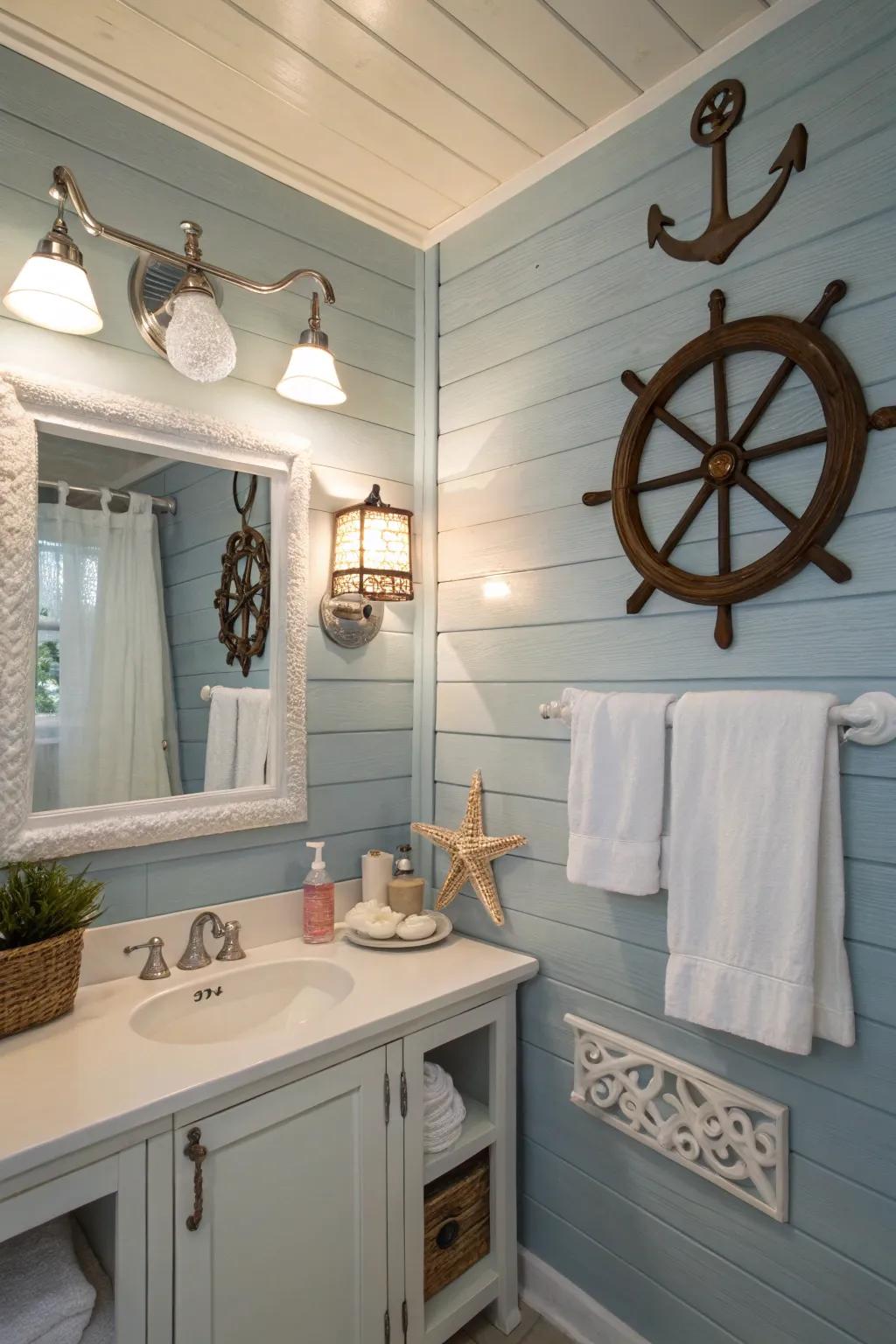 A bathroom showcasing soft blue board and batten walls complemented by nautical decorations.