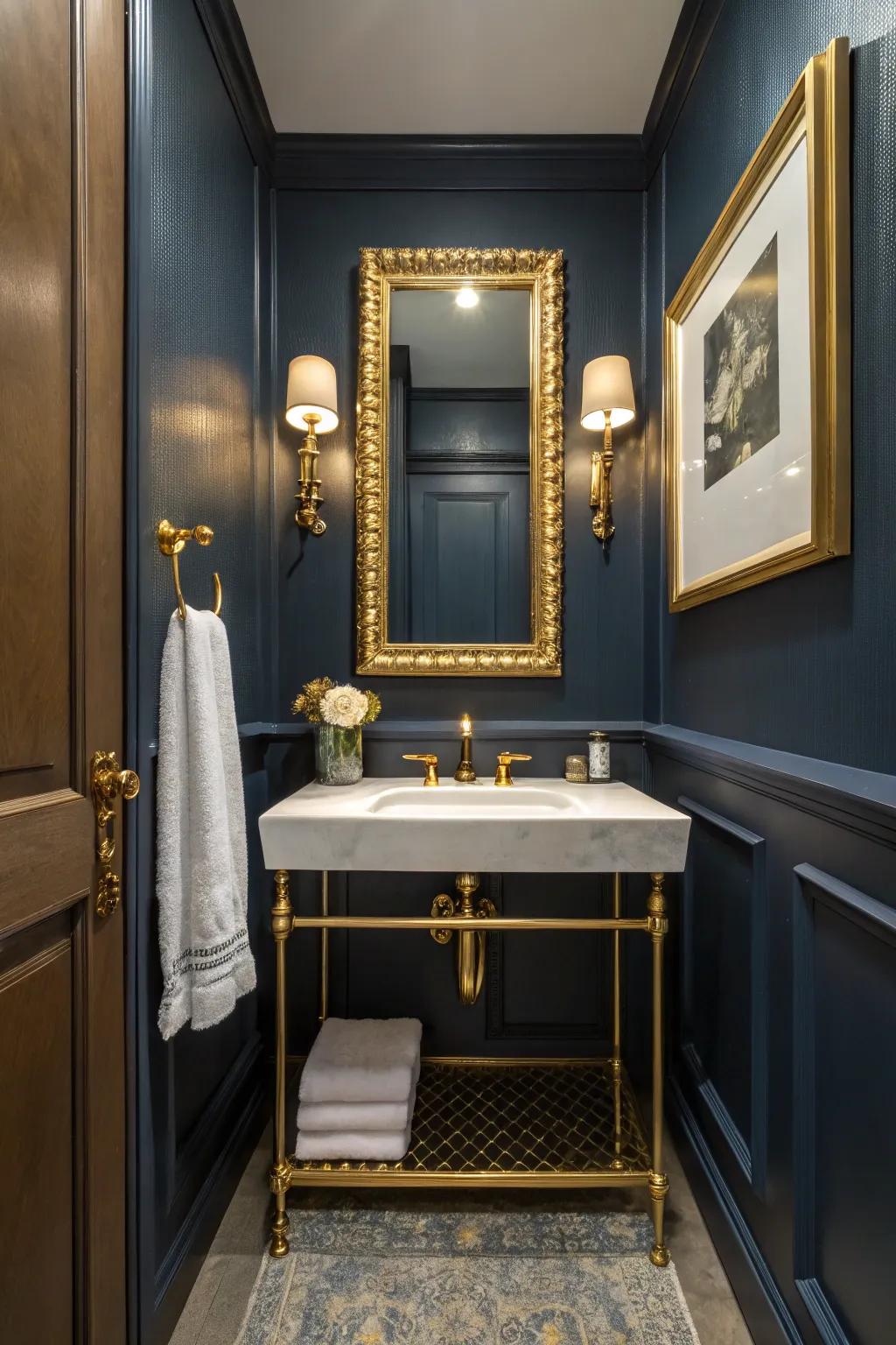 Gold accents bring a touch of opulence to the dark blue bathroom.