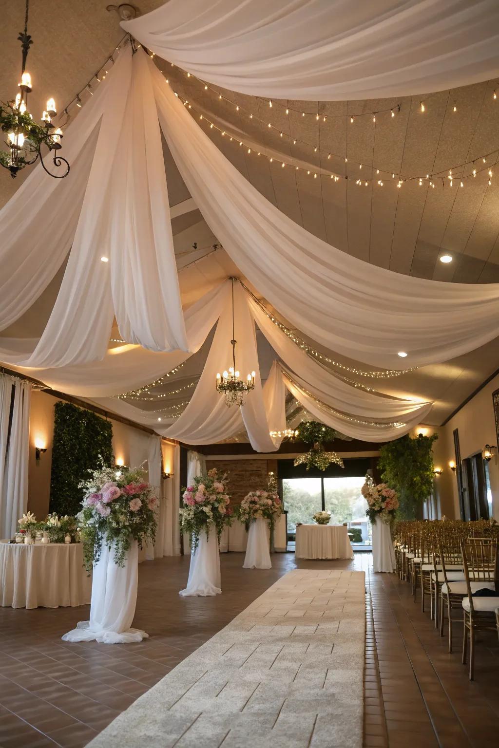 A romantic wedding venue with draped fabric on the ceiling.