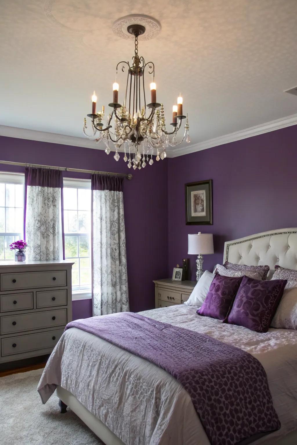 A statement chandelier illuminating purple walls elegantly.