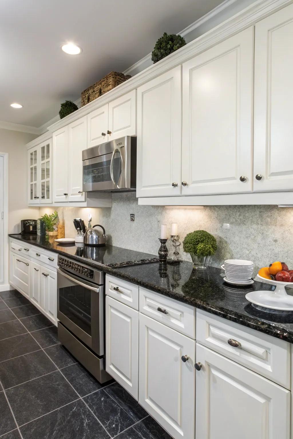 Dark countertops create a dramatic contrast with white cabinets.